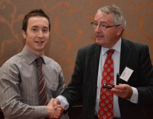 Liam accepting medal